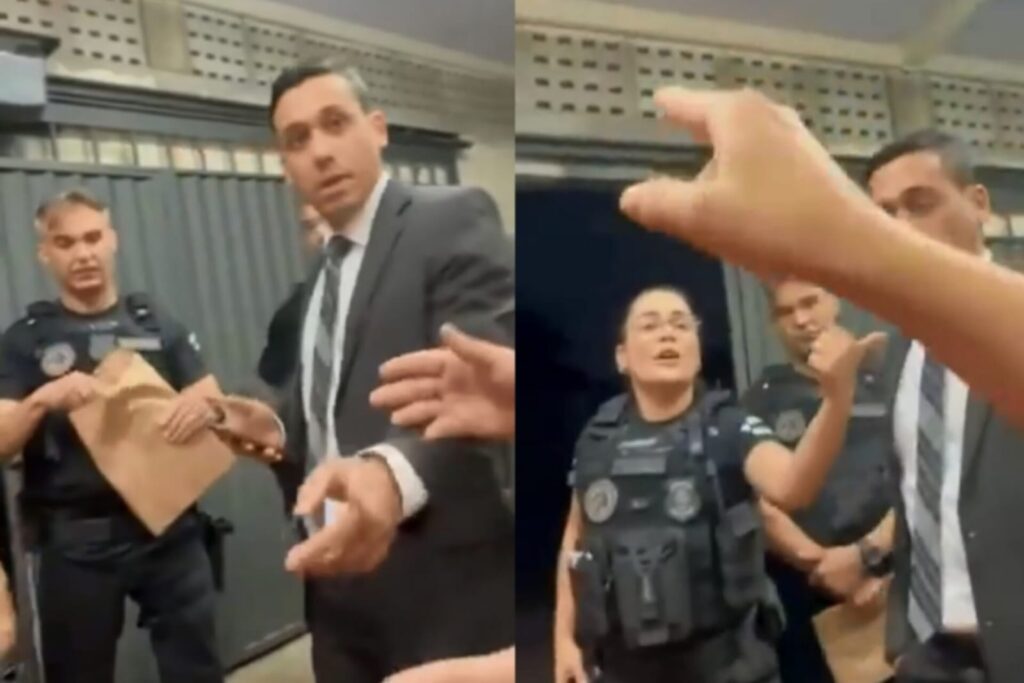 A mulher pede para saber o nome que consta nos mandados, o vídeo acaba após os moradores pedirem para ver o endereço no documento. (Foto: Captura)